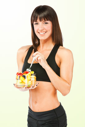 healthy woman eating fruit